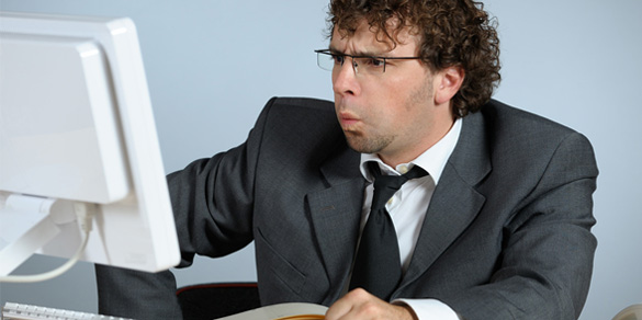 Employee visually frustrated with IT industry failures
